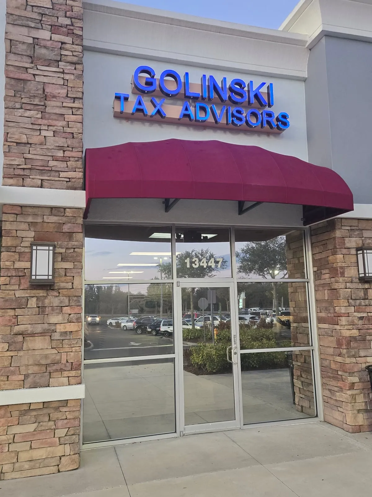 Golinski Tax Prep entrance at dusk, 13447 County Line Road, Spring Hill, FL